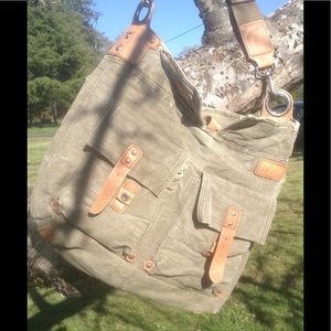 Distressed big canvas bag w/leather accents.